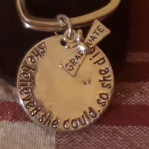 "Graduate" heart Keychain circle charm with engraved quote, "she believed..."